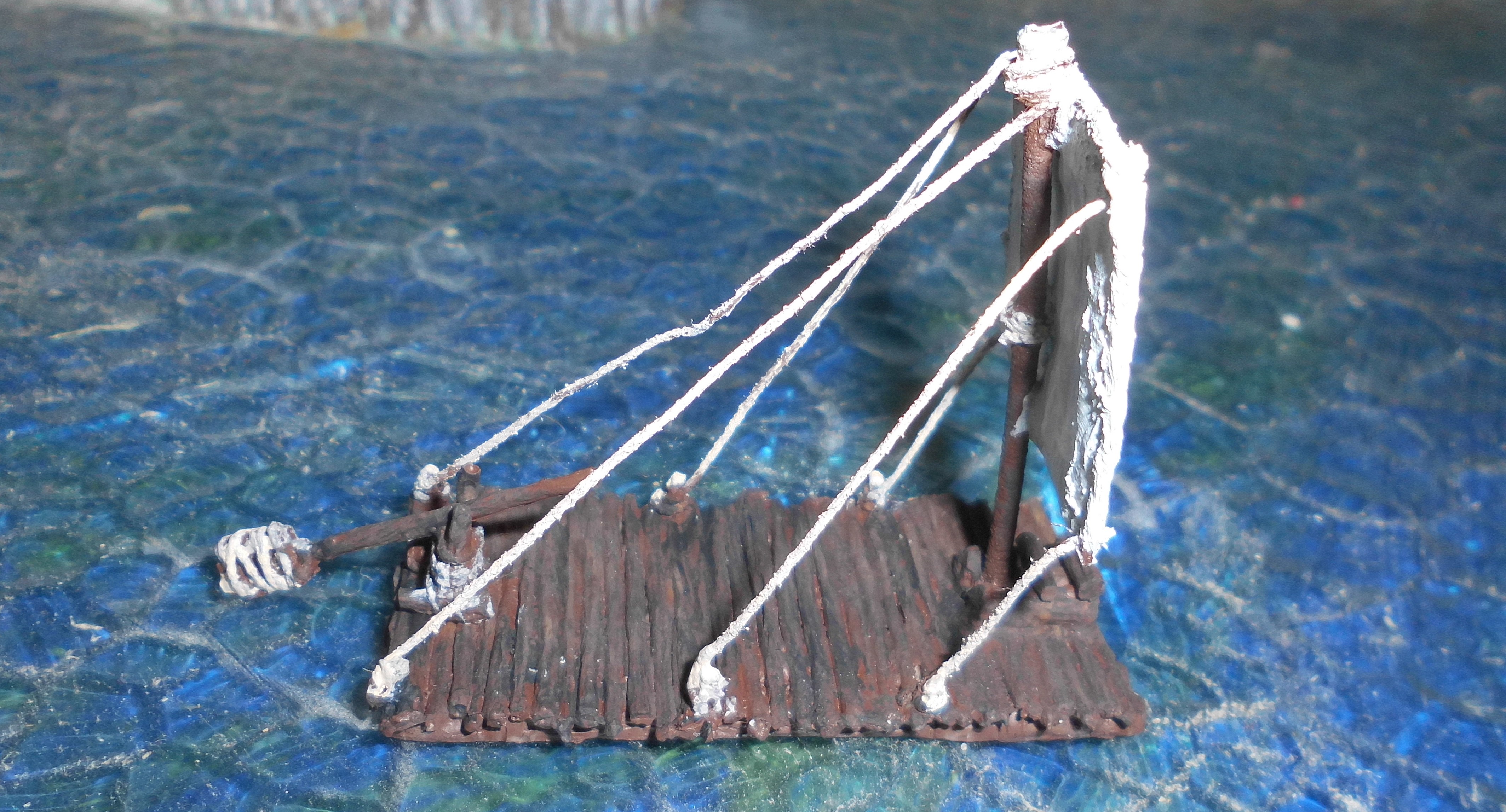 Ancient raft with sail - Click Image to Close